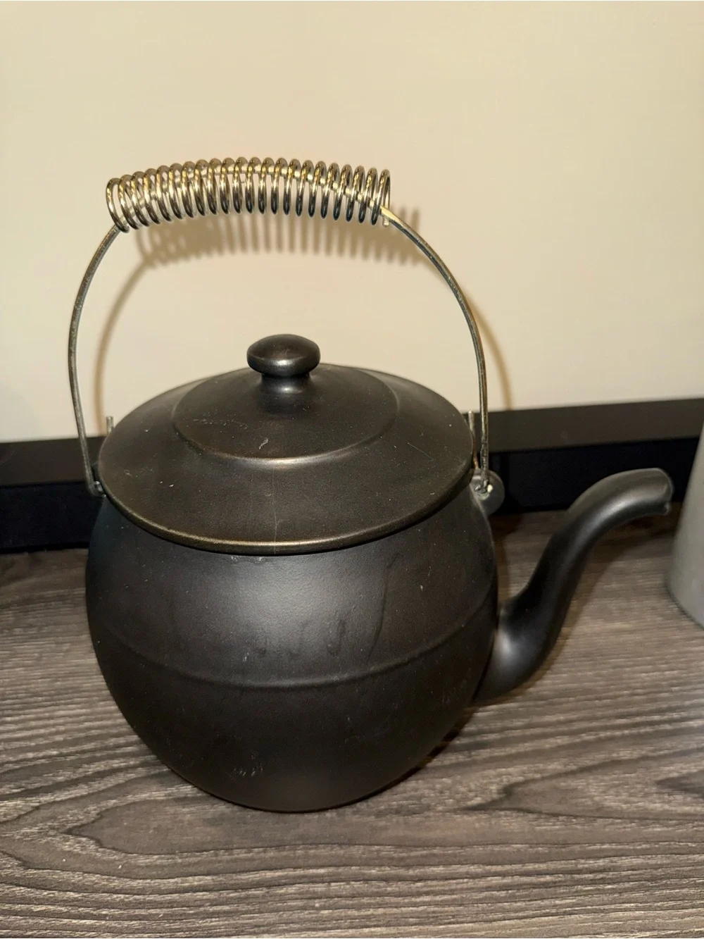McCoy Pottery Kookie Kettle cookie jar crafted from black ceramic